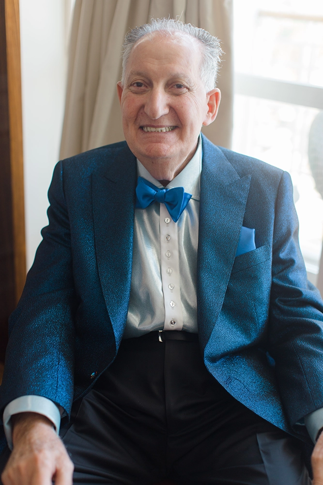 The original Mr. Alex in Metallic Blue Tuxedo Jacket with Swarovski Crystal Buttons